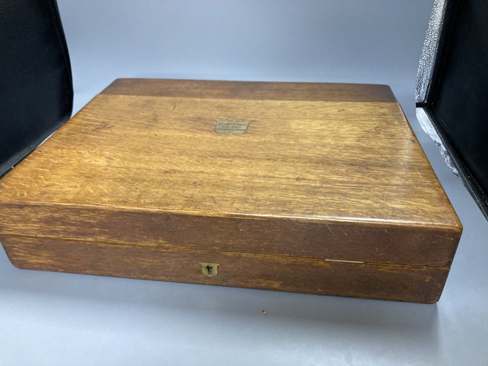 A Mappin & Webb service of plated flatware in an oak canteen